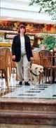 A Guide dog owner and her dog navigate a shopping centre