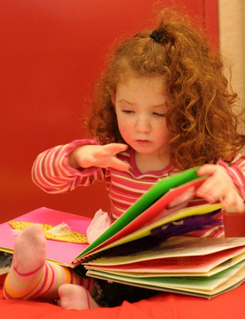 Sophie reading tactile book